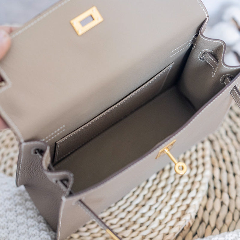 ملحقات الحقيبة الجلدية: حقيبة كلاتش مستوحاة من كيلي DWIPDFZS169